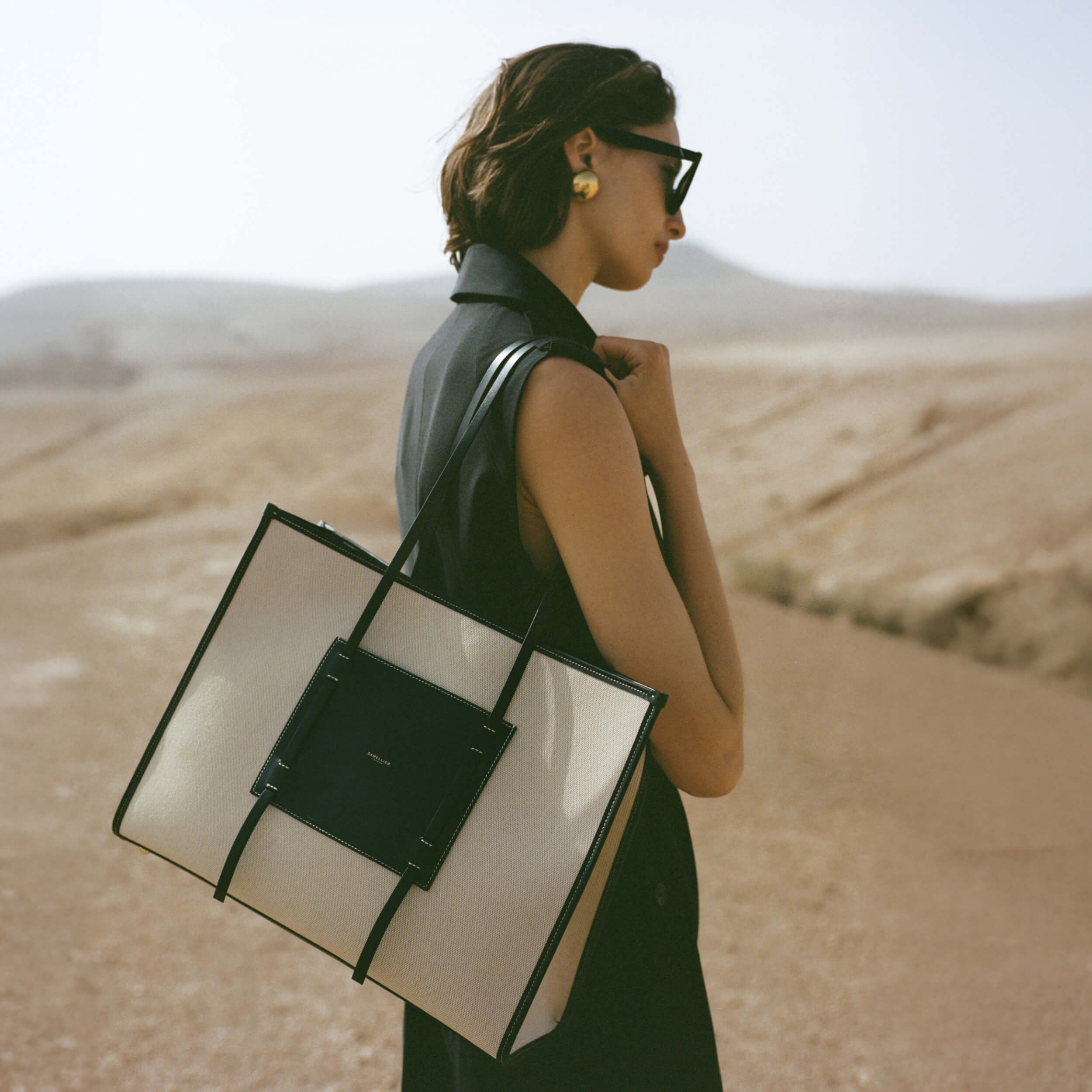 DeMellier The Large Capri salt & pepper canvas black smooth