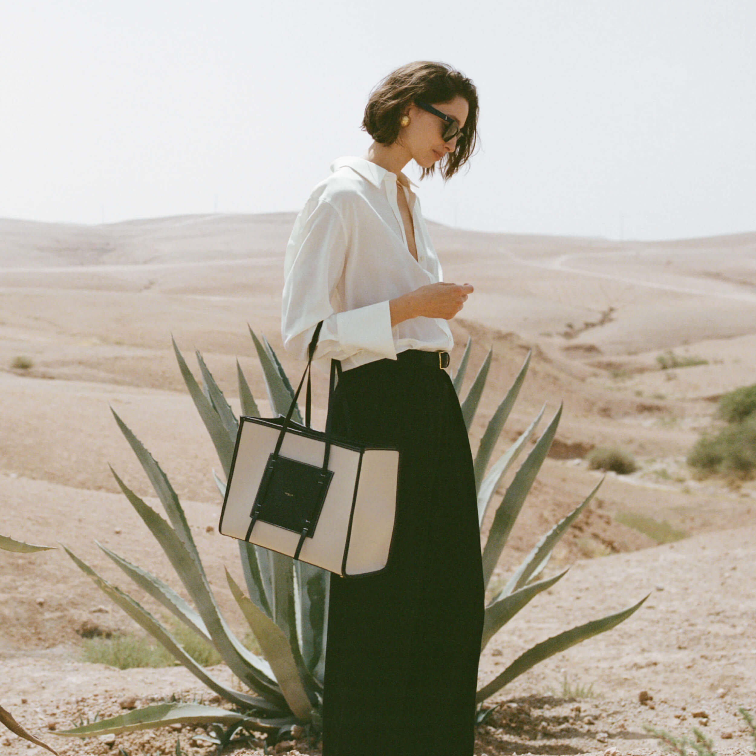 DeMellier The Capri salt & pepper canvas black smooth