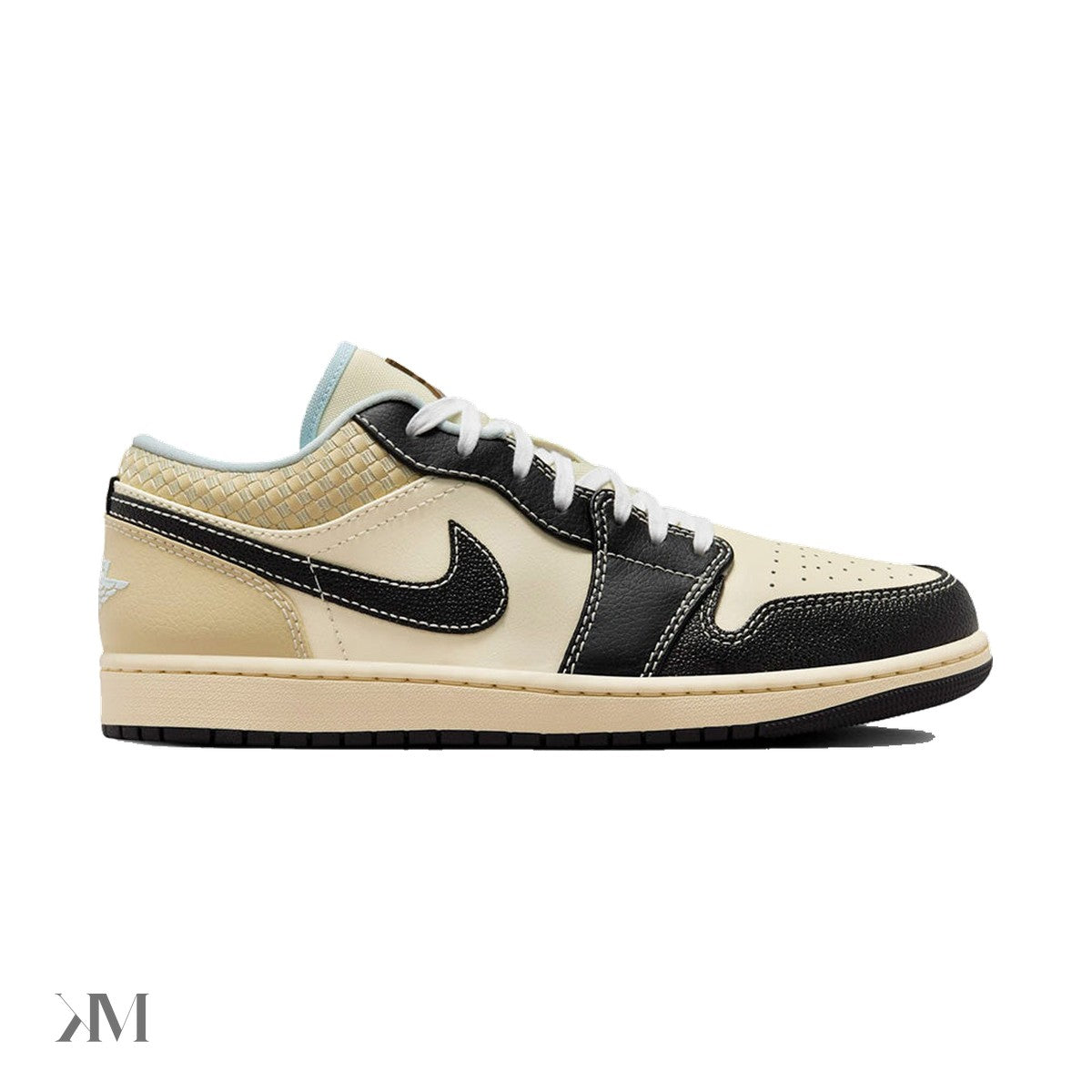Air Jordan 1 Low SE Coconut Milk Black Muslin lateral view showing leather toe cap and black Swoosh