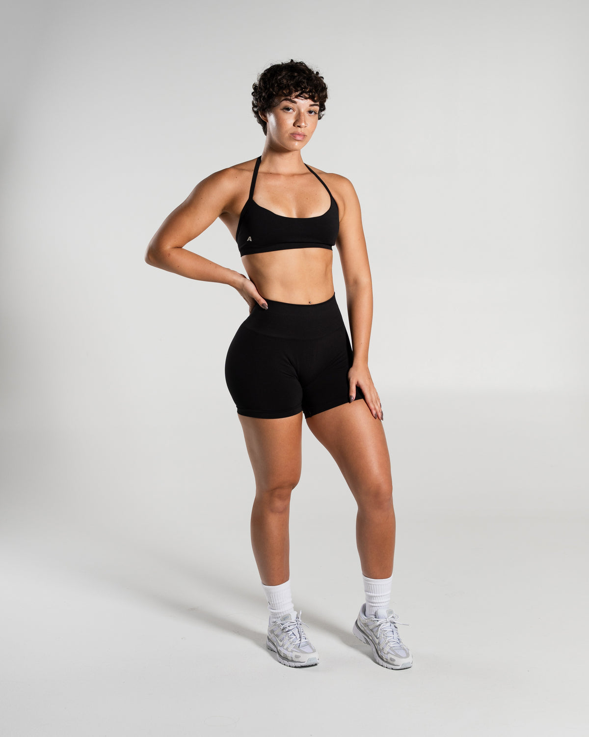 Alphalete Women's Amplify Mid Rise Short