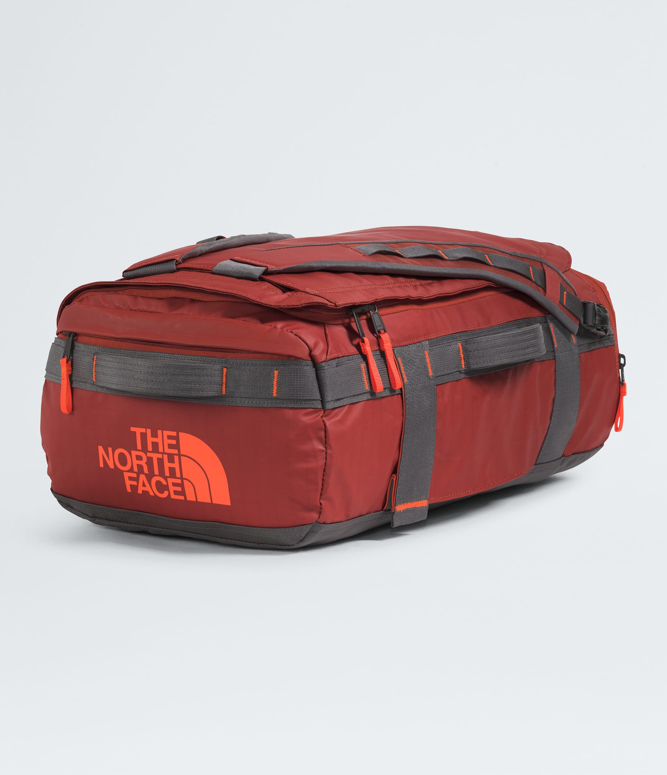 The North Face Base Camp™ Voyager Duffel—32L Iron Clay-Anthracite Grey-Lava Red