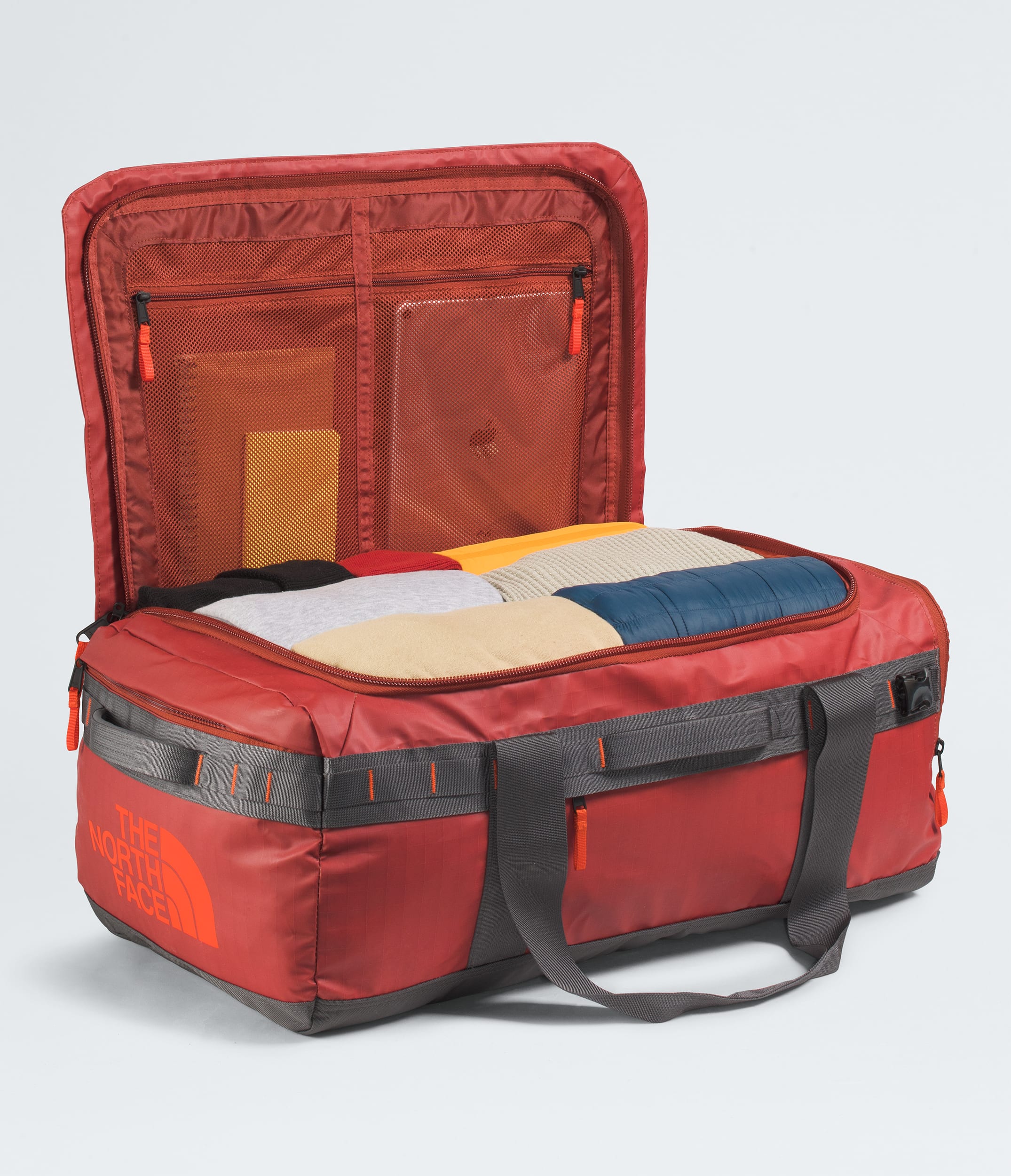 The North Face Base Camp™ Voyager Duffel—62L Iron Clay-Anthracite Grey-Lava Red
