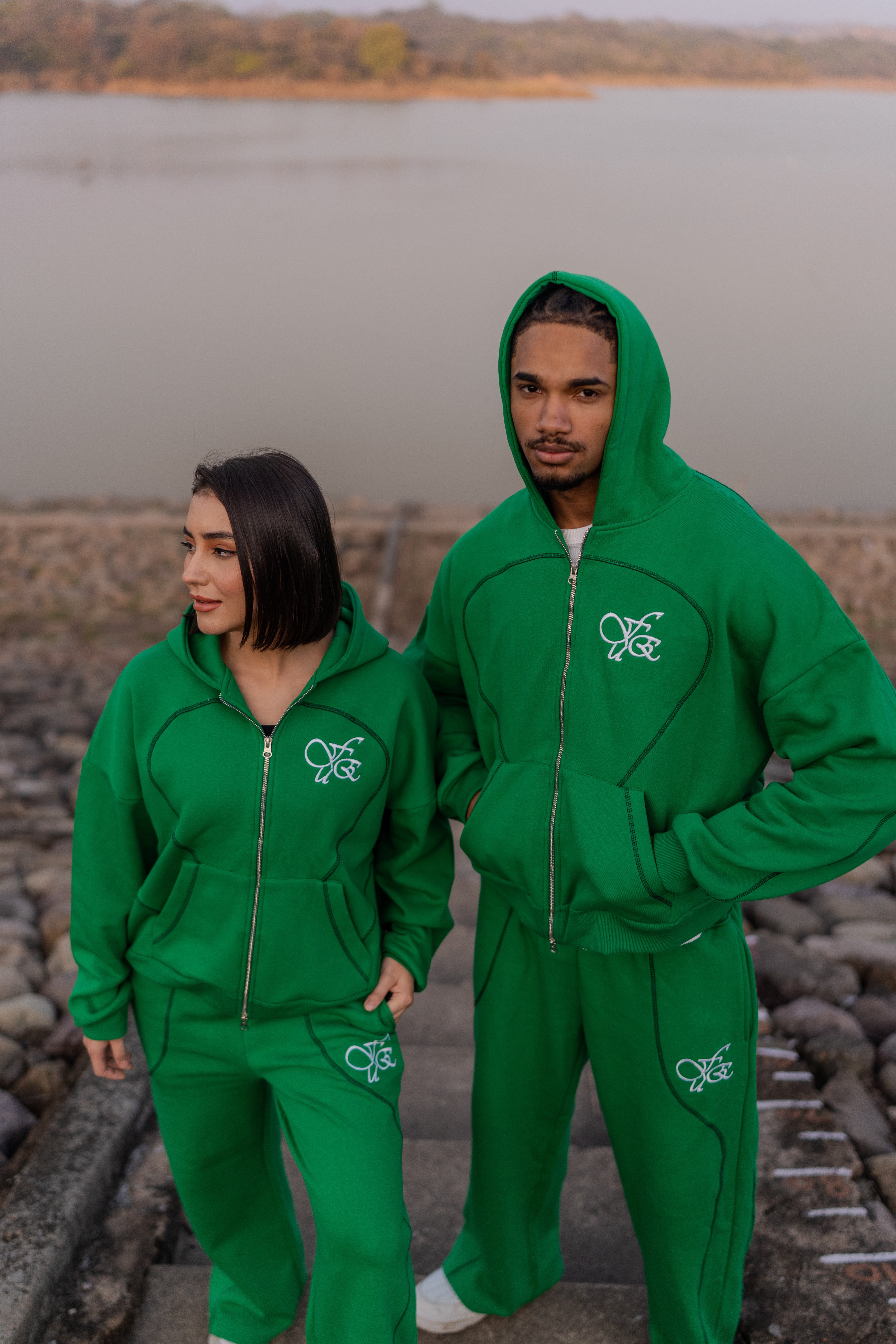 FUE Everyday Essential Sweatpants Green - couple wearing matching green tracksuits by waterside