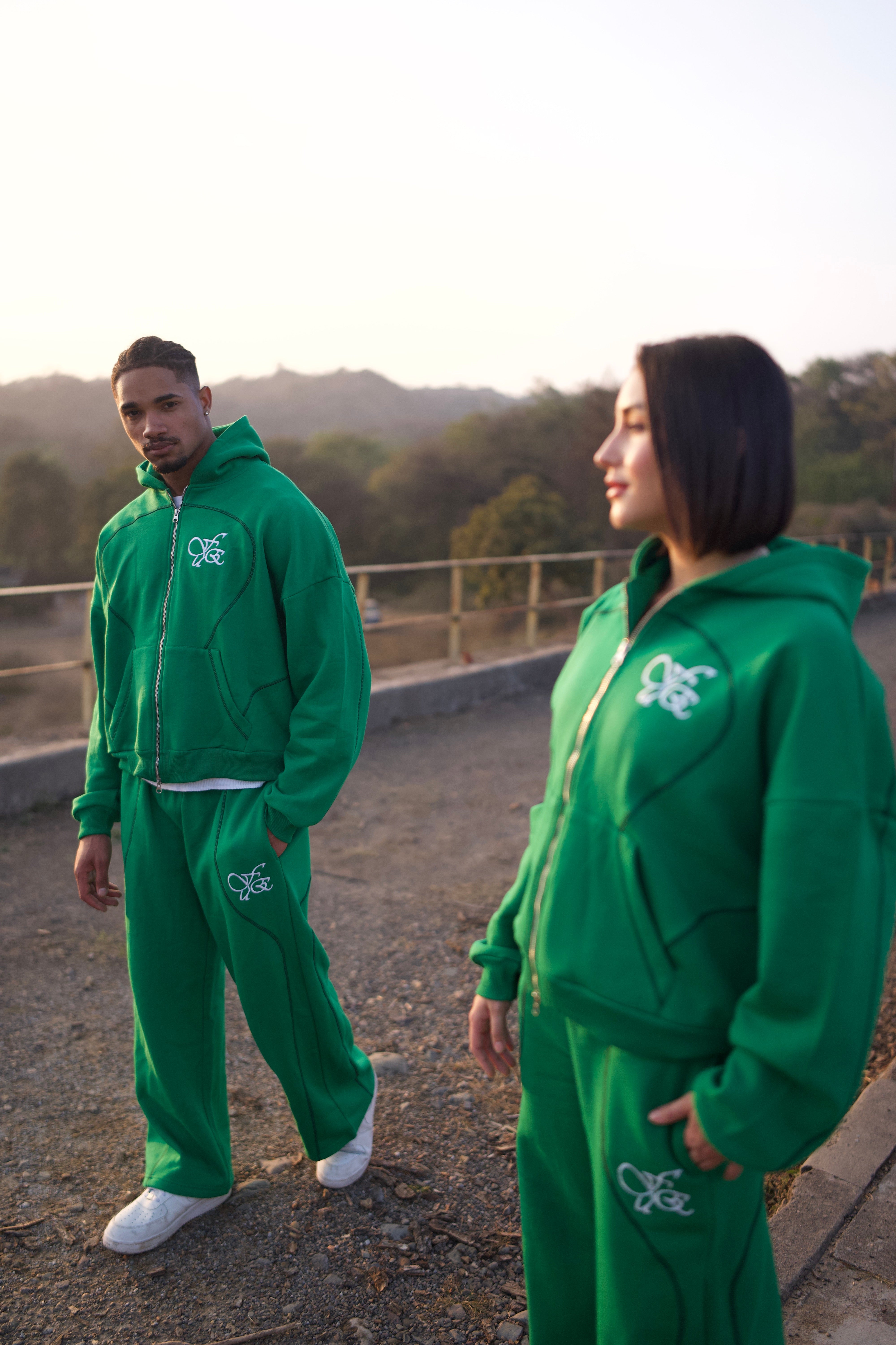 FUE Everyday Essential Sweatpants Green - male and female models in matching green tracksuits outdoors