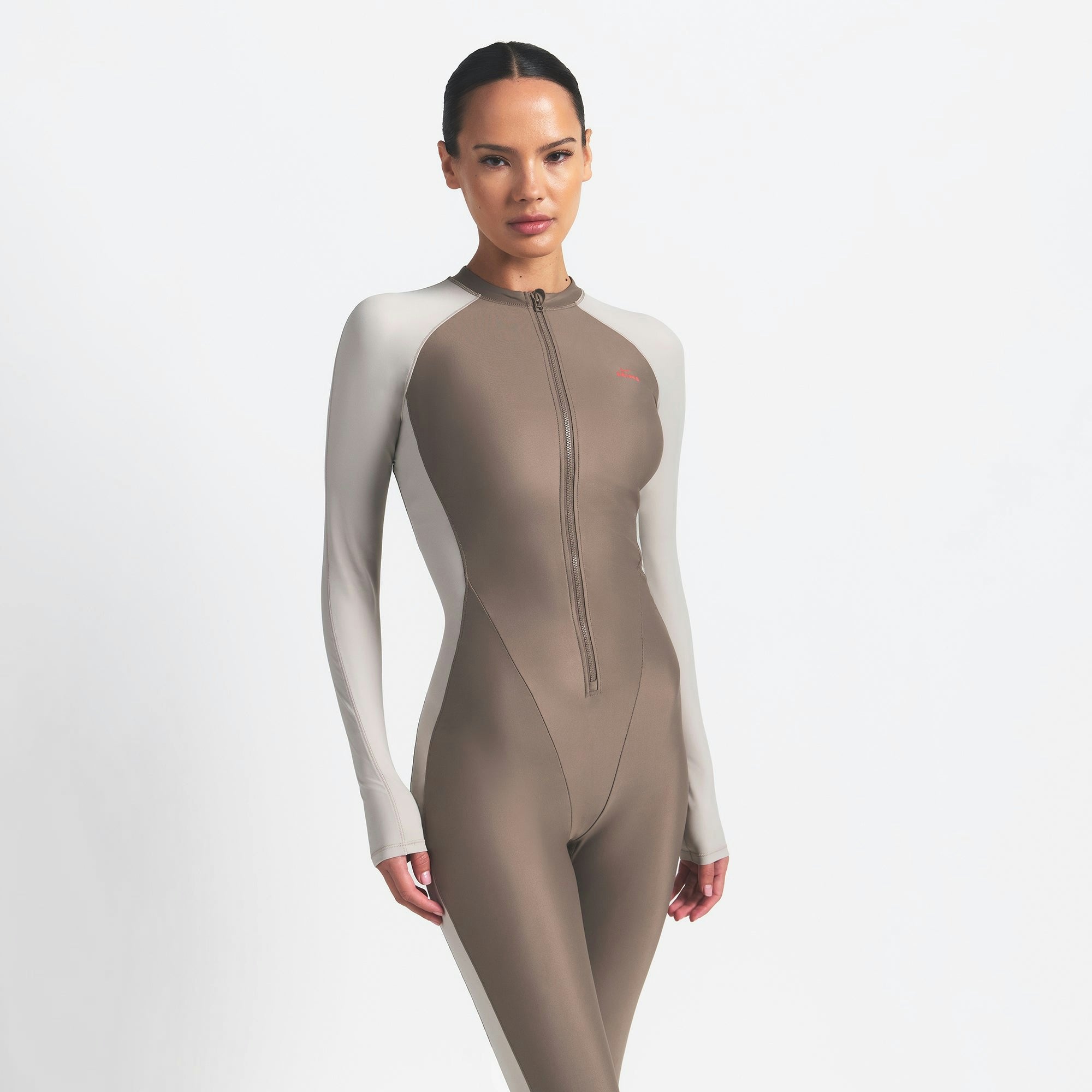 Skims Nikeskims Shine Zip Front Long Onesie Truffle And Stone