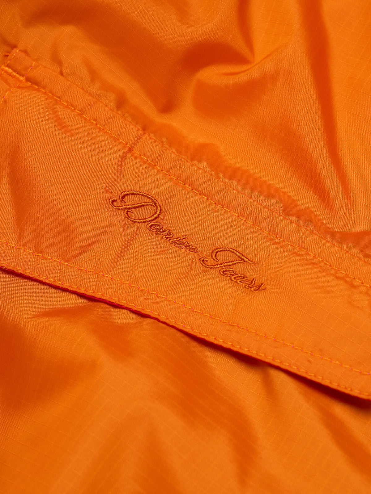 Denim Tears Script Windbreaker Orange