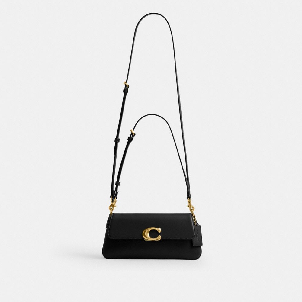 Women's Coach Jet Shoulder Bag, Brass and Black, worn