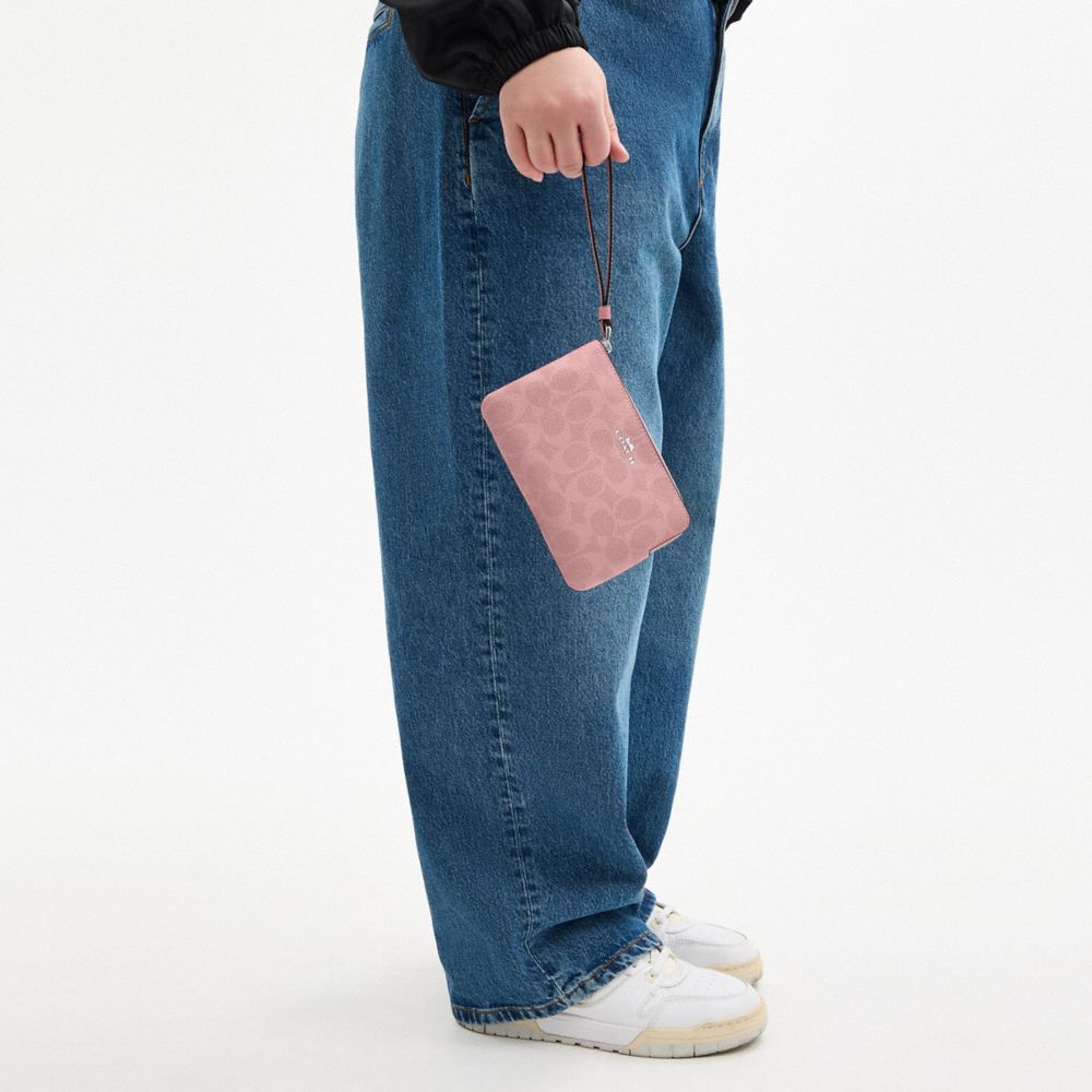 Coach Corner Zip Wristlet In Signature Canvas Sv Dusty Pink