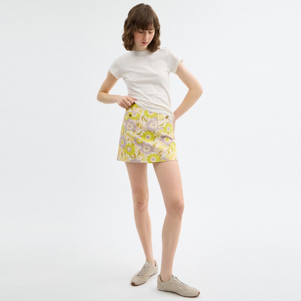 Coach Cotton Canvas Mini Skirt In Regenerative Cotton Yellow Floral
