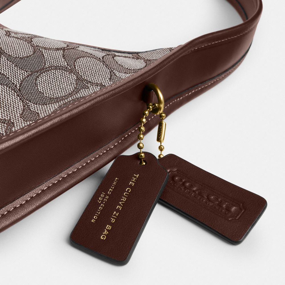 Coach Curve Zip Bag In Signature Jacquard Brass Oak Maple
