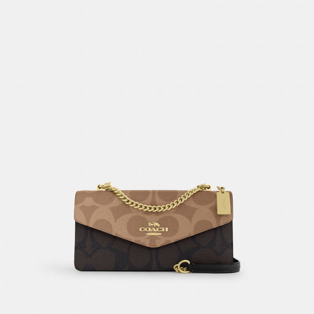 Coach Klare Envelope Crossbody Bag In Blocked Signature Canvas Gold Walnut Tan