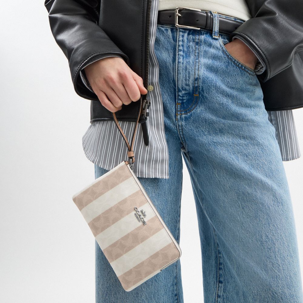 Coach Large Corner Zip Wristlet In Signature Canvas Sv Sand Tan