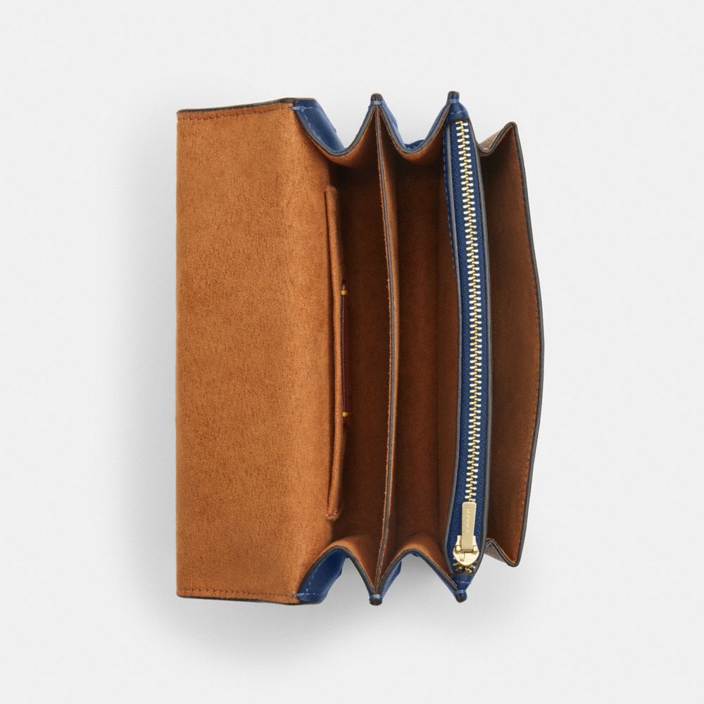 Coach Mini Klare Crossbody Bag In Signature Canvas Im Deep Blue Tan