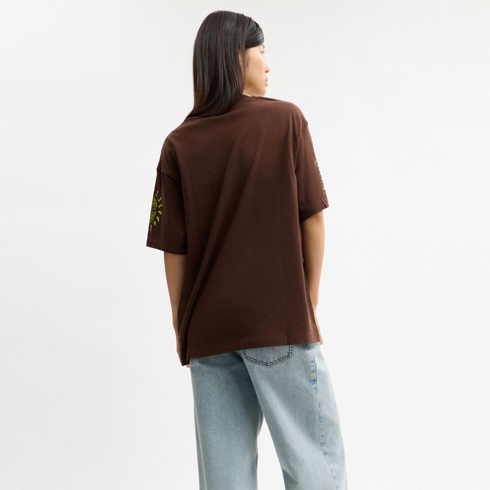 Coach Coach Graphic Relaxed T Shirt In Organic Cotton Brown