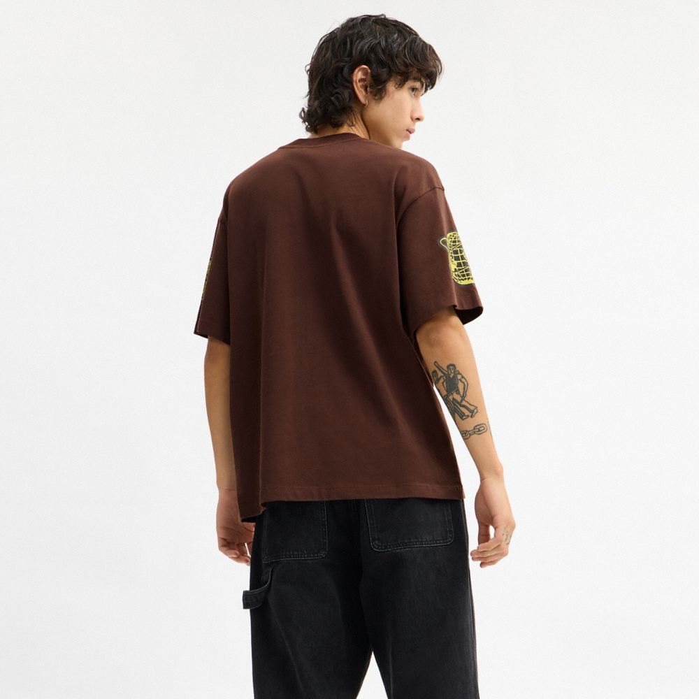 Coach Coach Graphic Relaxed T Shirt In Organic Cotton Brown