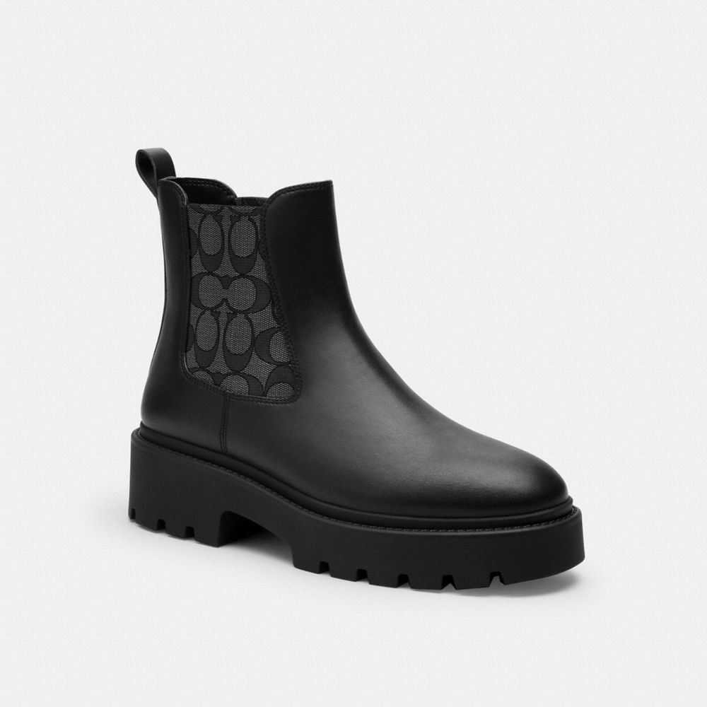 Coach Lucy Chelsea Boot in Black with Signature polyester upper and block heel, side view