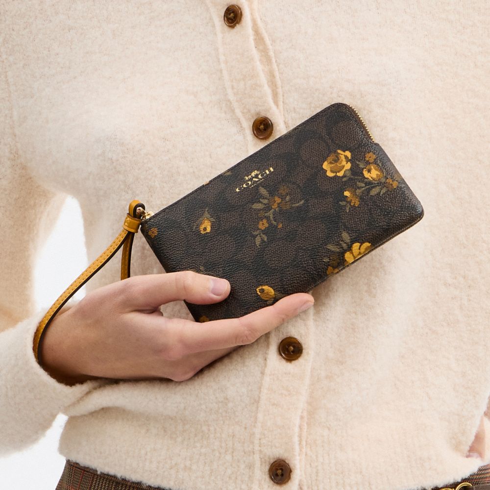 Coach Corner Zip Wristlet In Signature Canvas With Floral Print Im Walnut Yellow