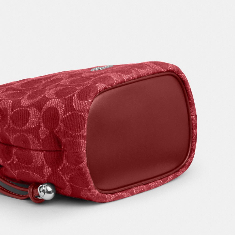 Coach Faye Mini Drawstring Bag In Signature Denim Silver True Red