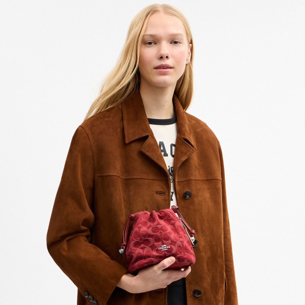 Coach Faye Mini Drawstring Bag In Signature Denim Silver True Red