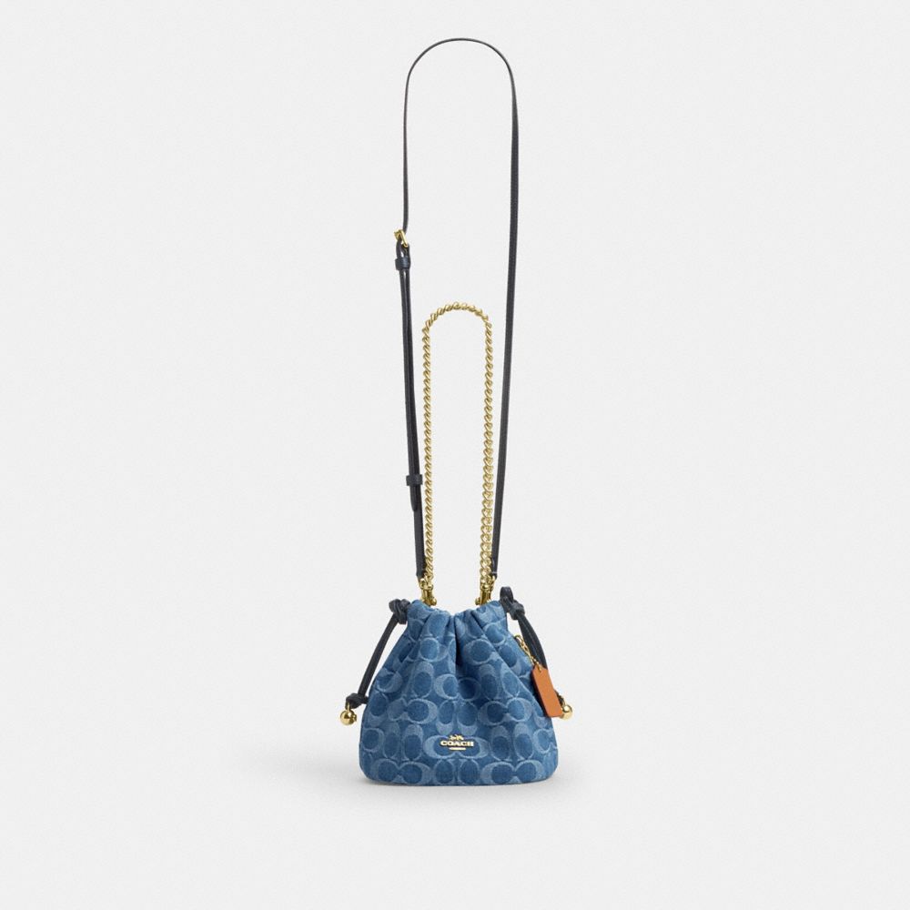 Coach Faye Mini Drawstring Bag In Signature Denim Gold Indigo