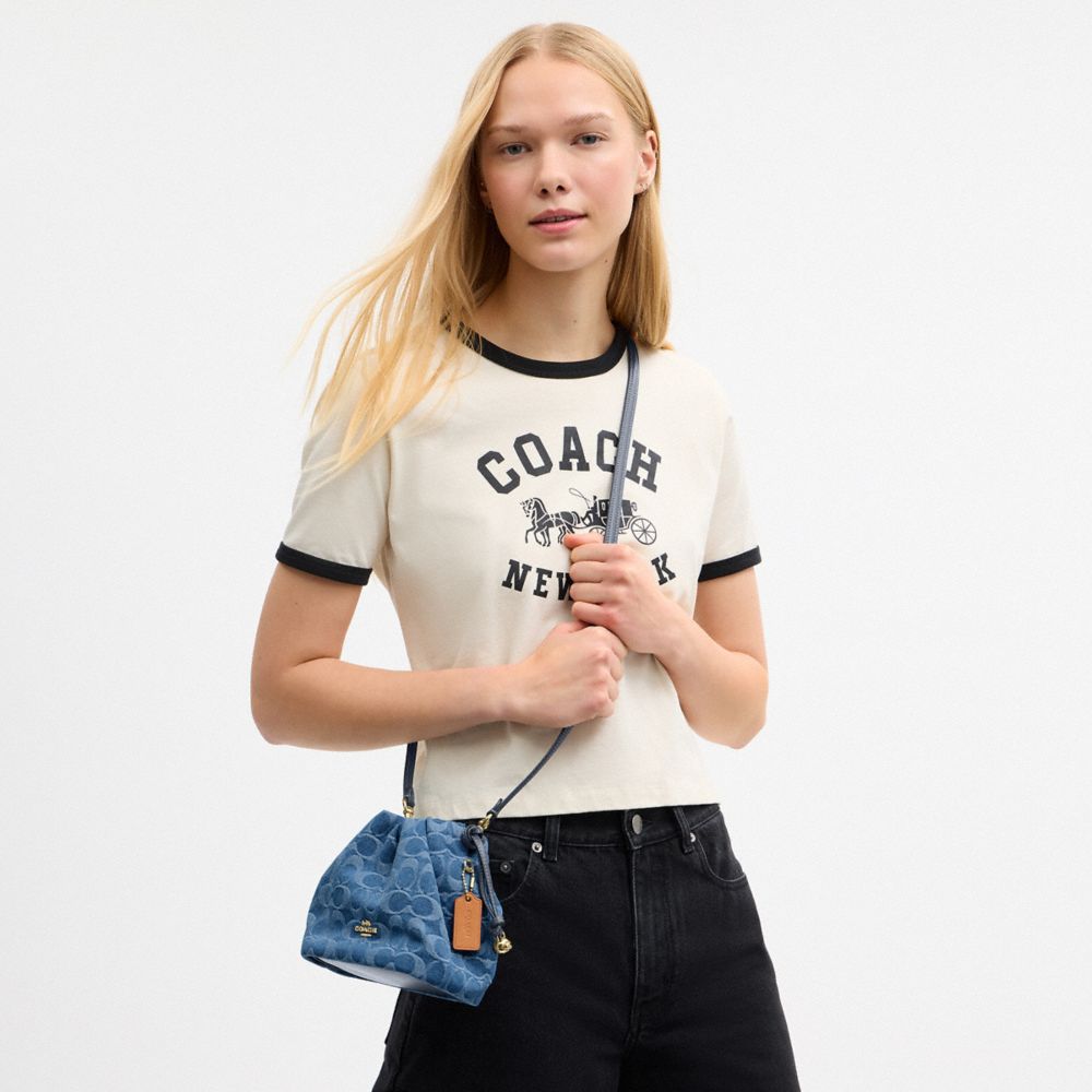 Coach Faye Mini Drawstring Bag In Signature Denim Gold Indigo