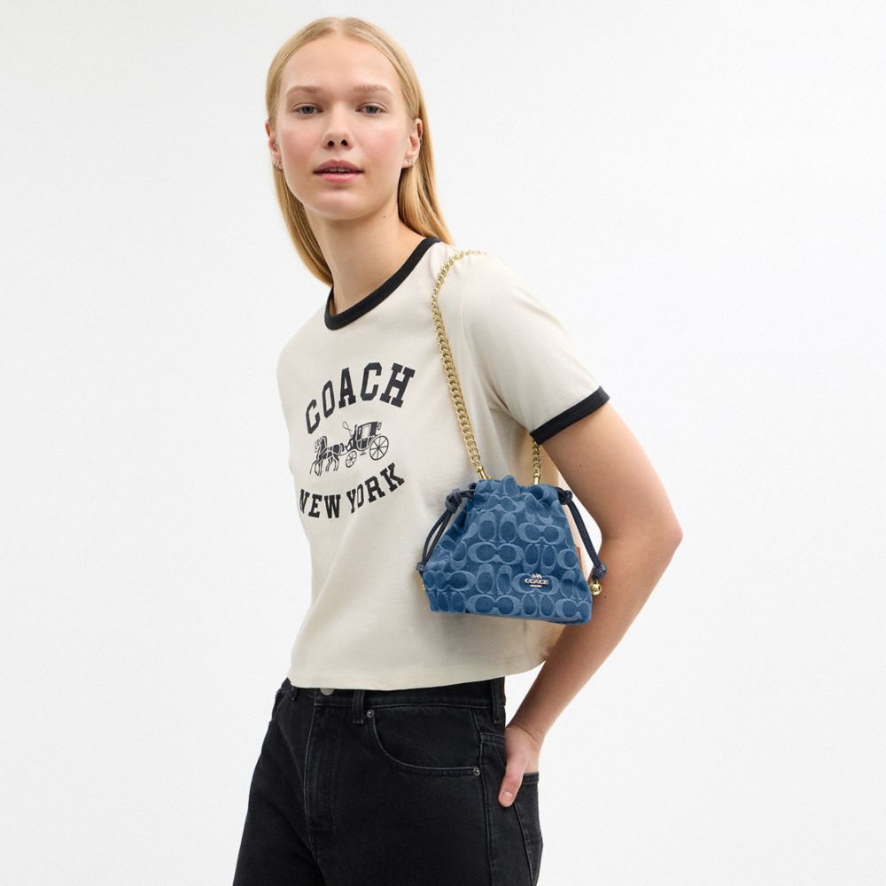 Coach Faye Mini Drawstring Bag In Signature Denim Gold Indigo