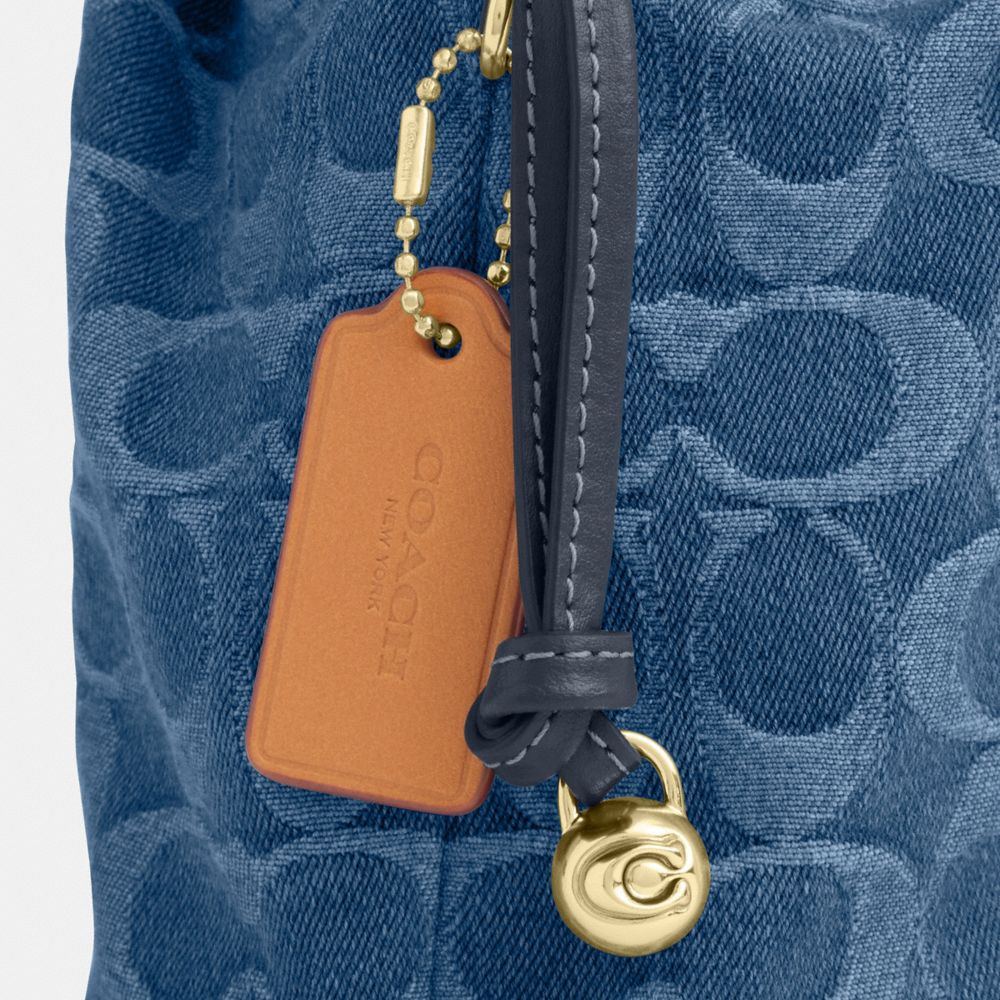 Coach Faye Mini Drawstring Bag In Signature Denim Gold Indigo
