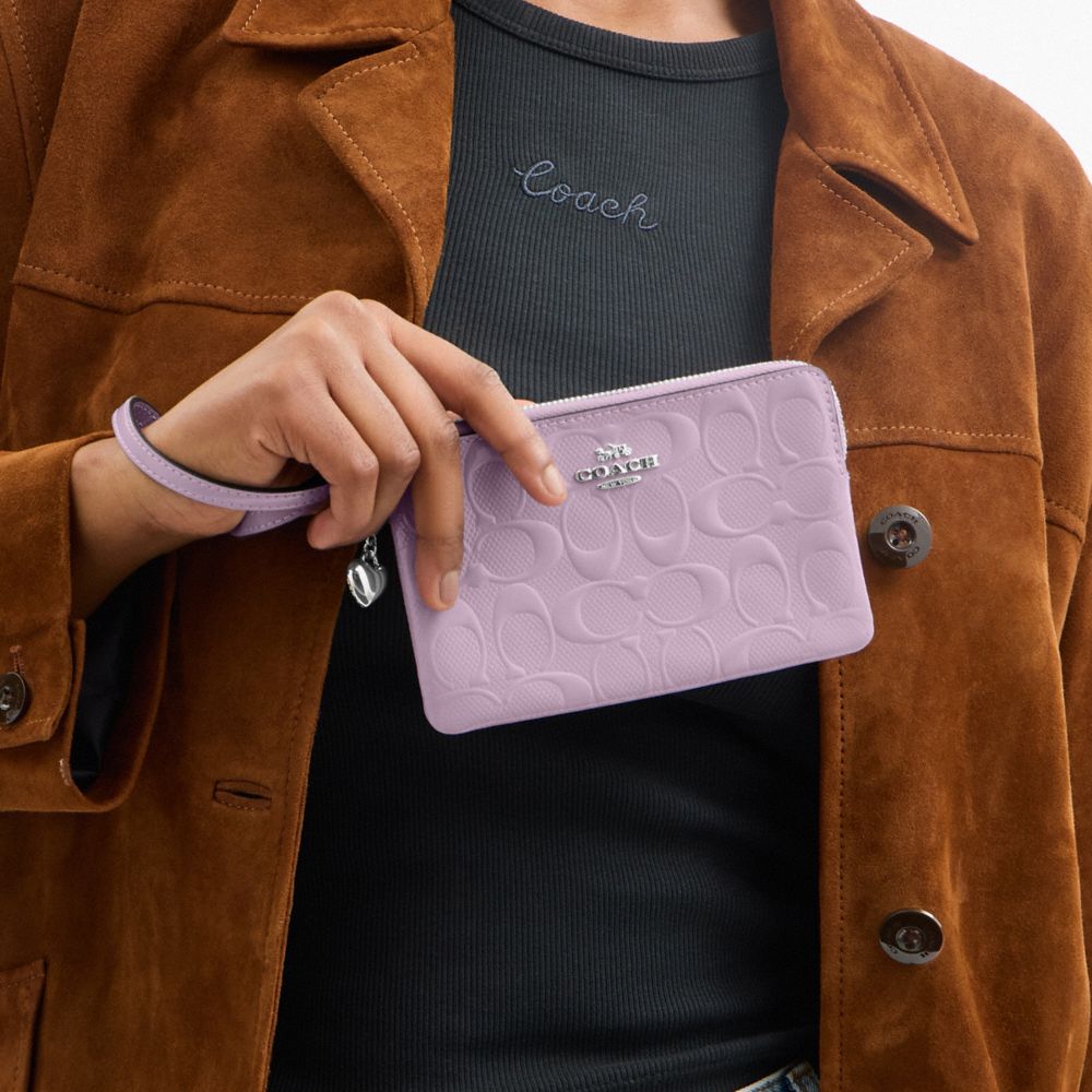 Coach Corner Zip Wristlet In Signature Leather With Heart Charm Silver Light Violet