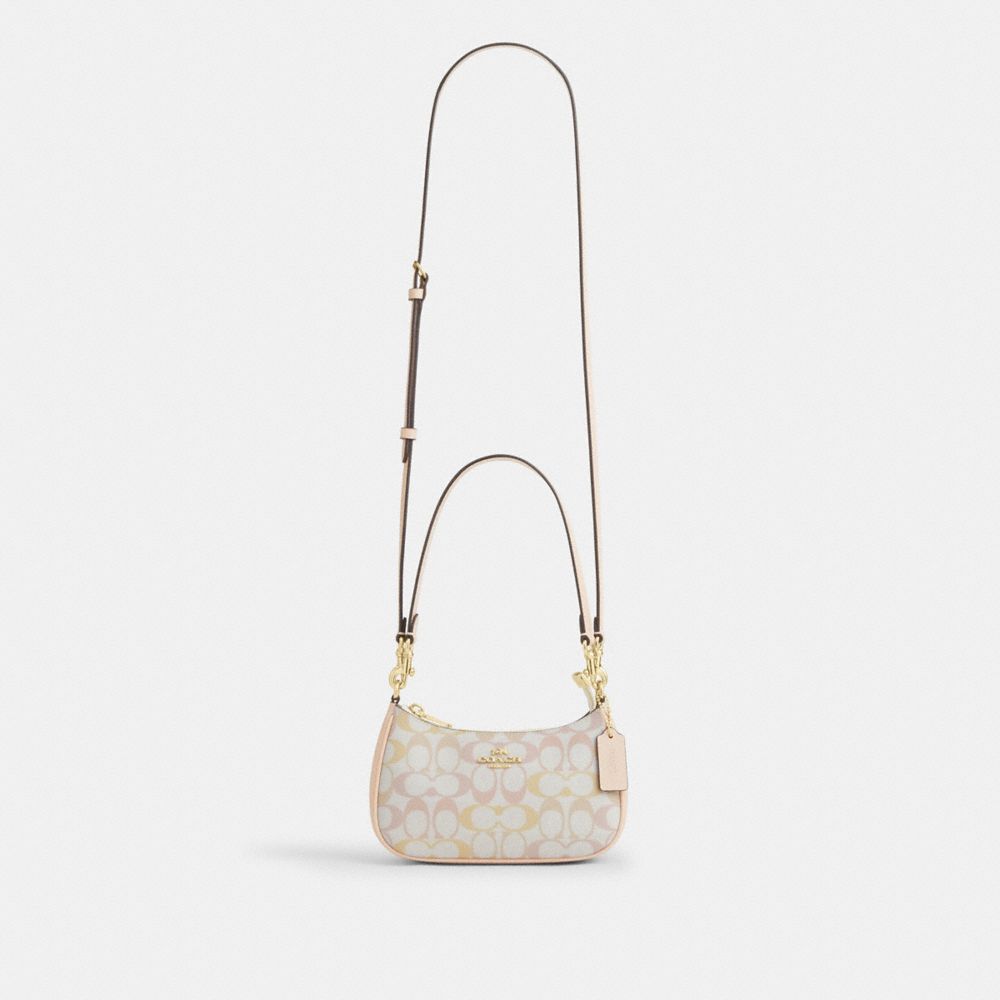 Coach Teri Mini Crossbody Bag In Signature Canvas Gold Chalk Pink