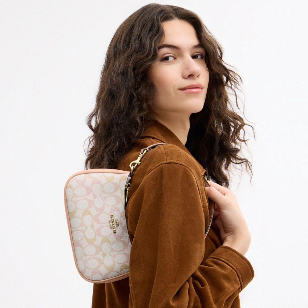 Coach Teri Mini Crossbody Bag In Signature Canvas Gold Chalk Pink