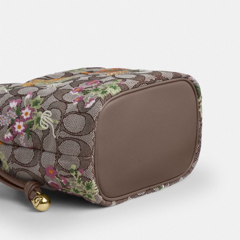 Coach Faye Mini Drawstring Bag In Signature Jacquard With Floral Embroidery Gold Oak Multi