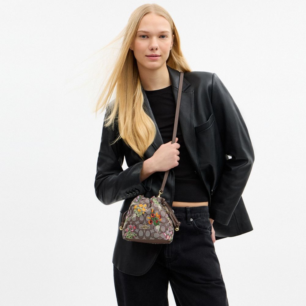 Coach Faye Mini Drawstring Bag In Signature Jacquard With Floral Embroidery Gold Oak Multi