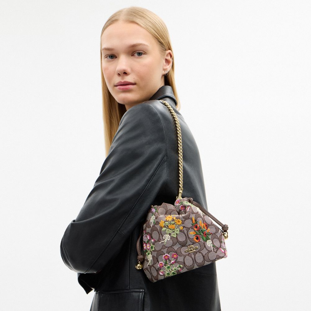 Coach Faye Mini Drawstring Bag In Signature Jacquard With Floral Embroidery Gold Oak Multi