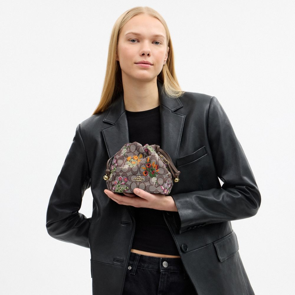 Coach Faye Mini Drawstring Bag In Signature Jacquard With Floral Embroidery Gold Oak Multi