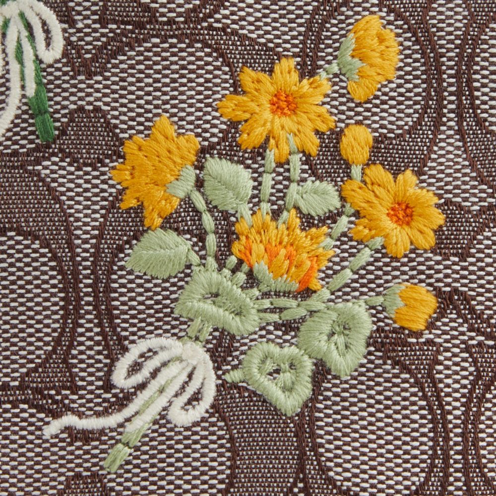 Coach Faye Mini Drawstring Bag In Signature Jacquard With Floral Embroidery Gold Oak Multi