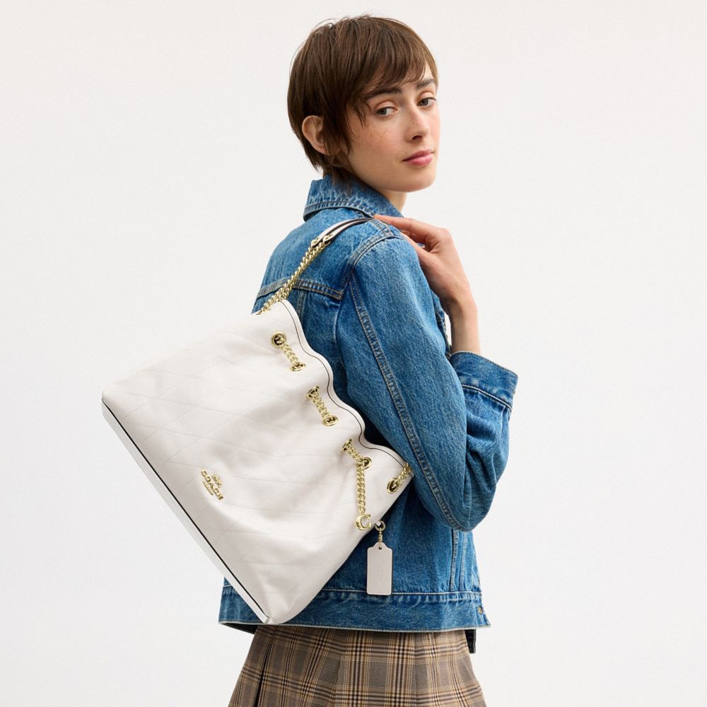 Coach Evelyn Shoulder Bag With Quilting And Charm Gold Chalk