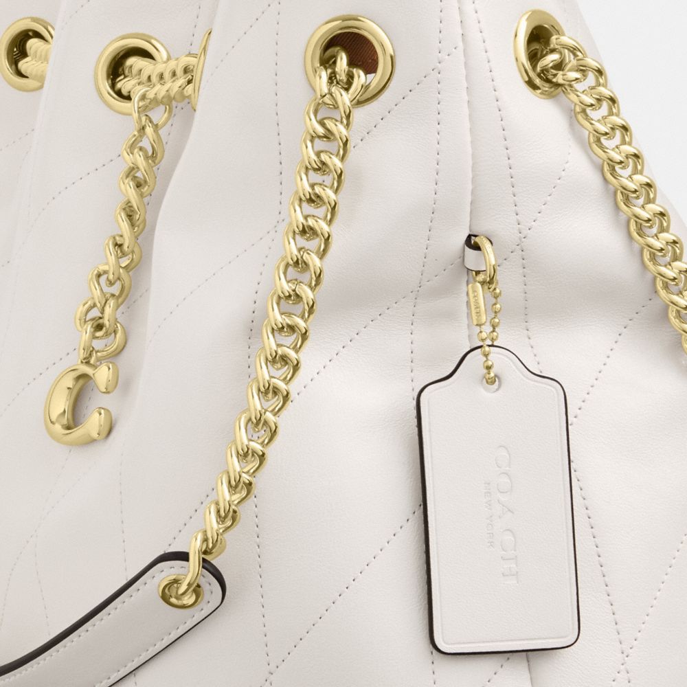 Coach Evelyn Shoulder Bag With Quilting And Charm Gold Chalk