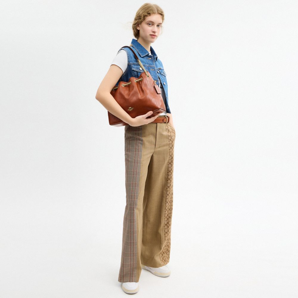 Coach Evelyn Shoulder Bag With Quilting And Charm Gold Cinnamon