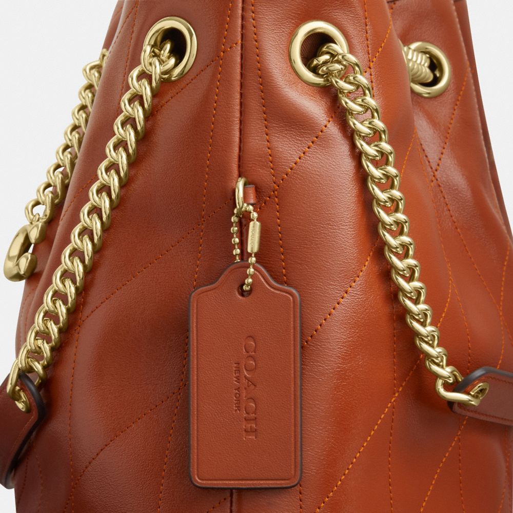 Coach Evelyn Shoulder Bag With Quilting And Charm Gold Cinnamon