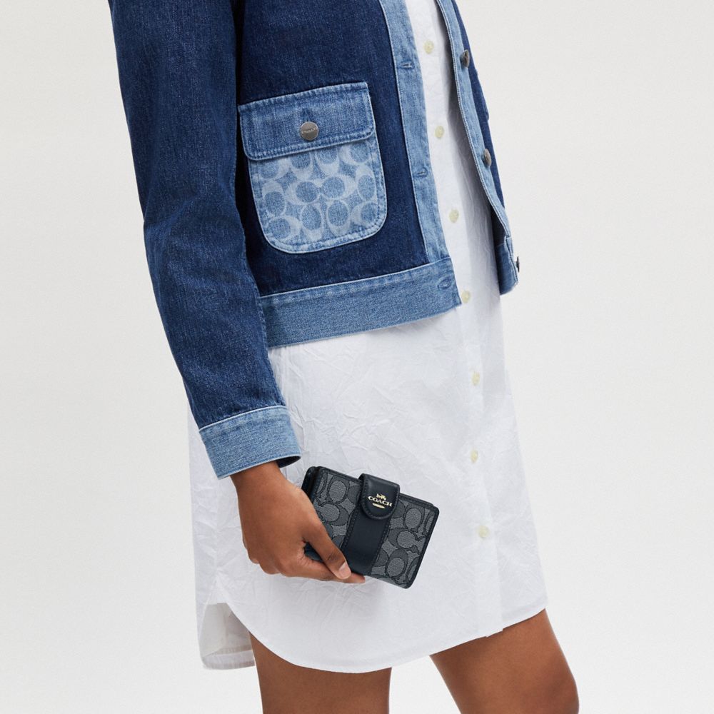 Coach Medium Corner Zip Wallet In Signature Jacquard Gold Navy Midnight Navy