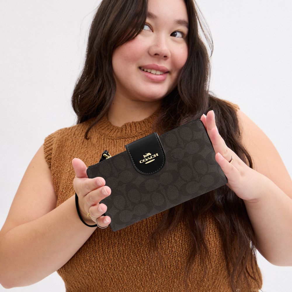 Coach Phone Wallet In Signature Canvas Gold Walnut Black