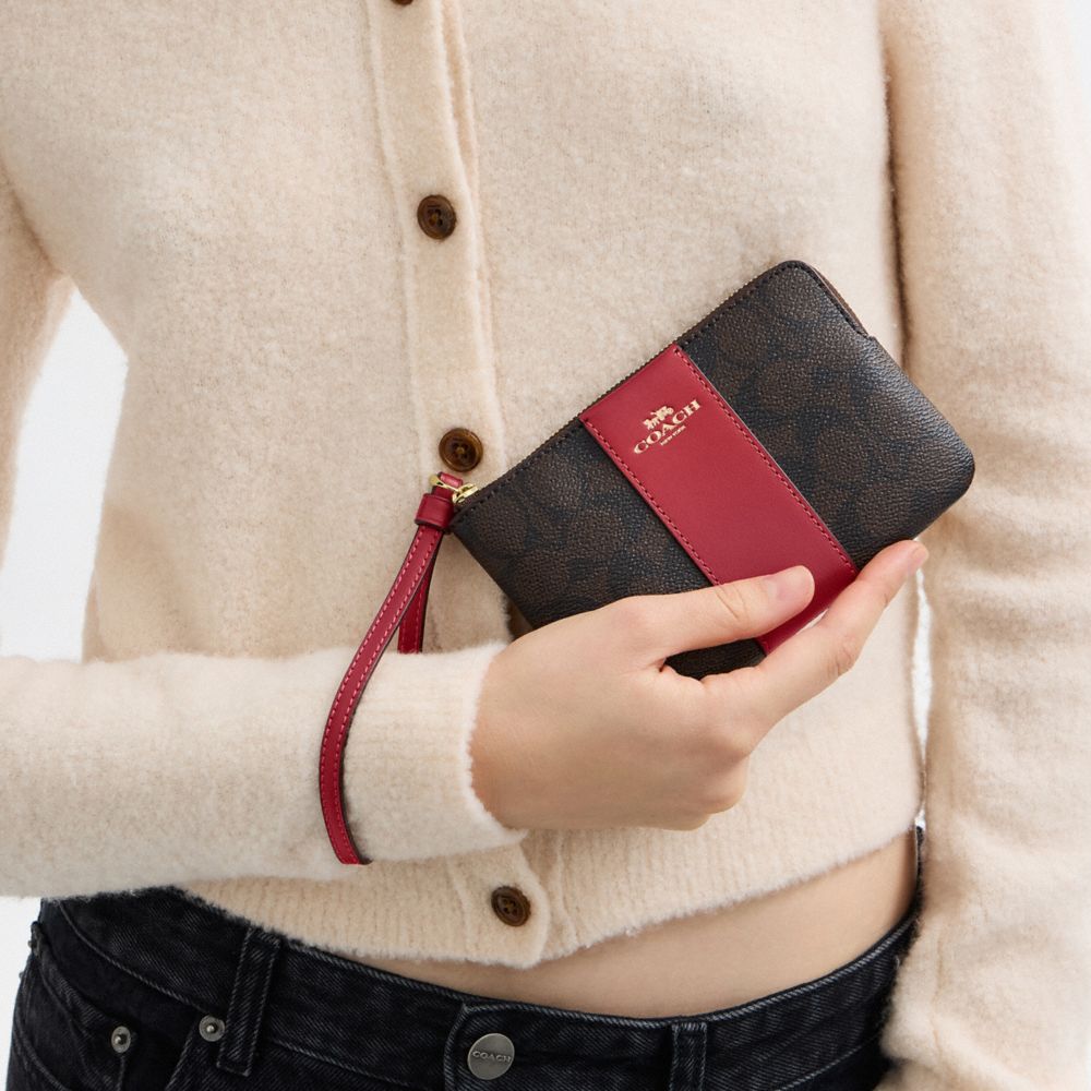 Coach Corner Zip Wristlet In Signature Canvas With Stripe Gold