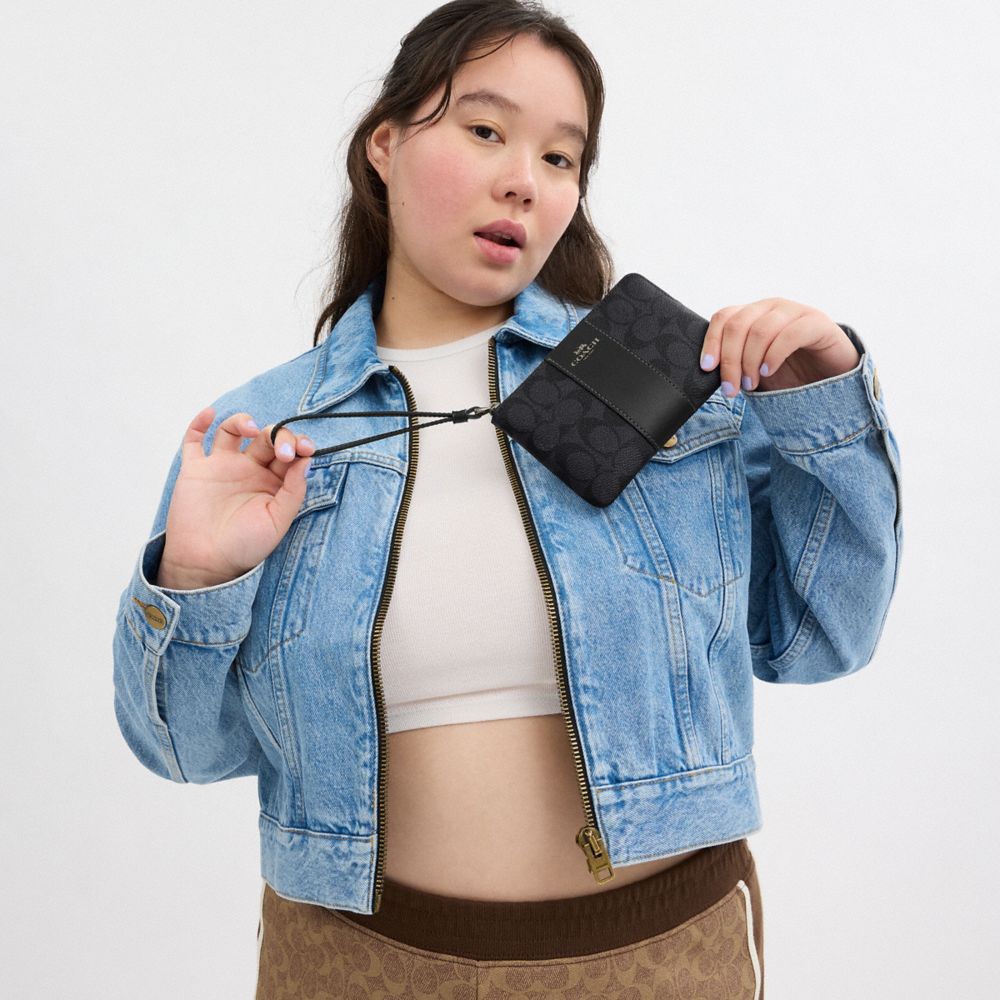 Coach Corner Zip Wristlet In Signature Canvas With Stripe Gunmetal Charcoal Black