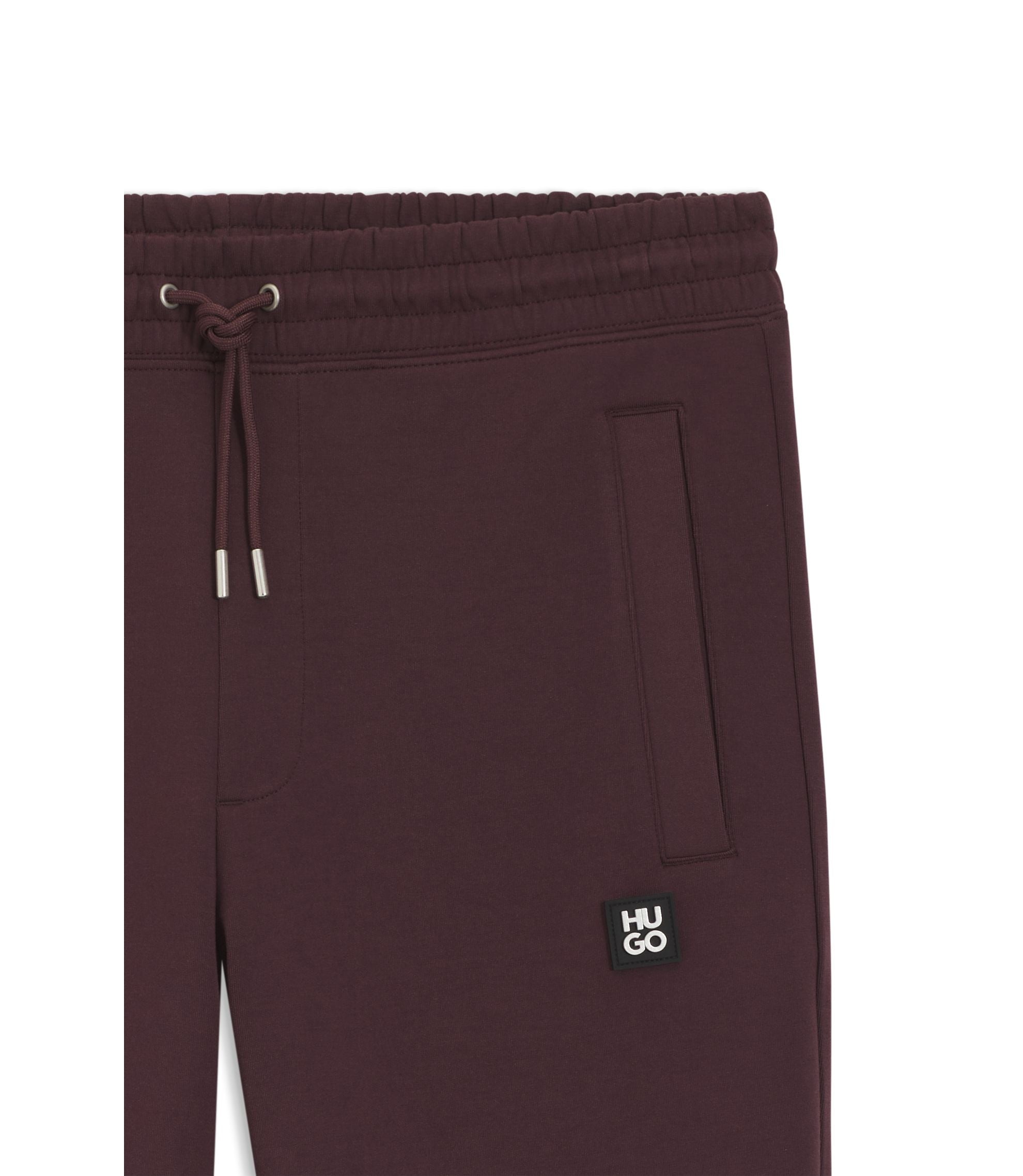 Hugo Stacked Logo Tracksuit Bottoms In A Cotton Blend Light Brown