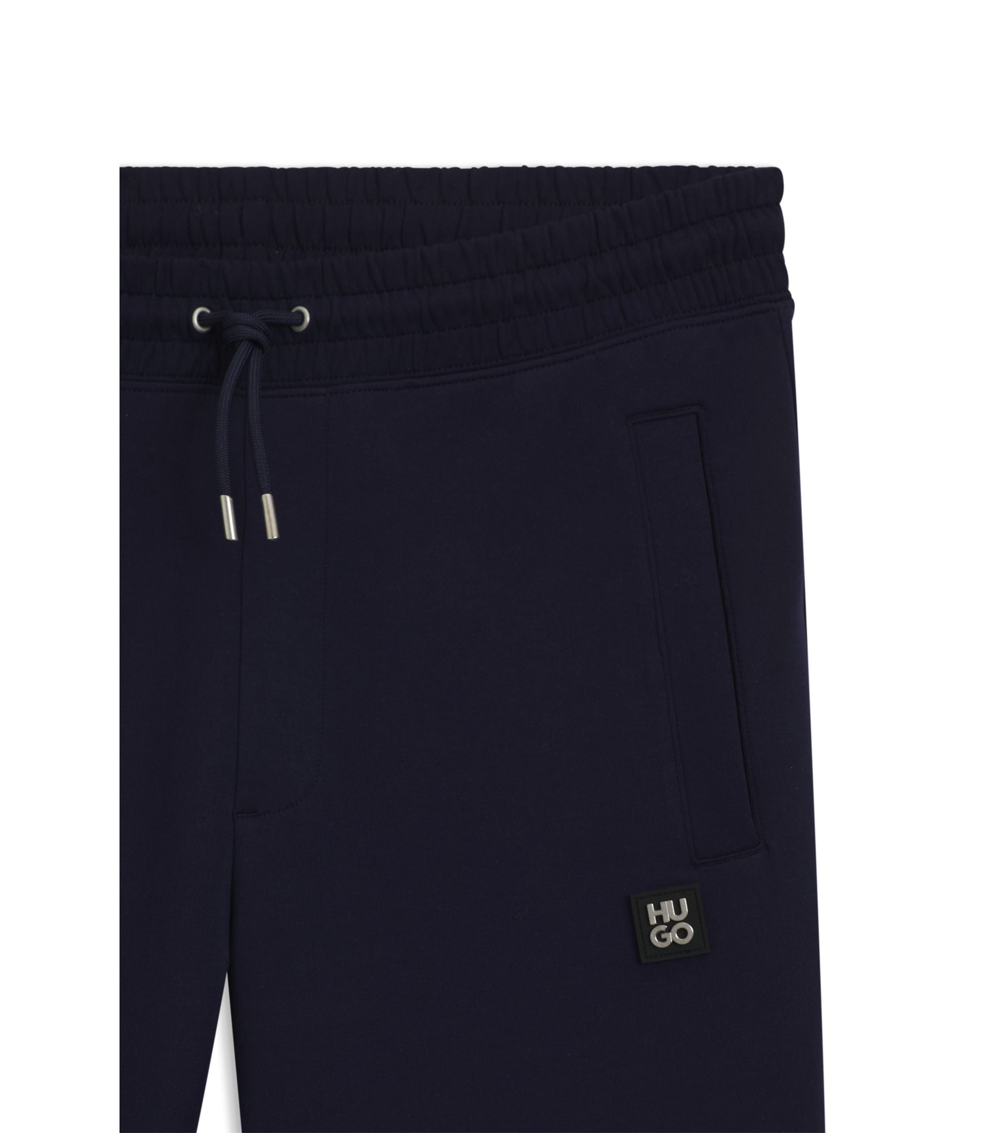 Hugo Stacked Logo Tracksuit Bottoms In A Cotton Blend Dark Blue