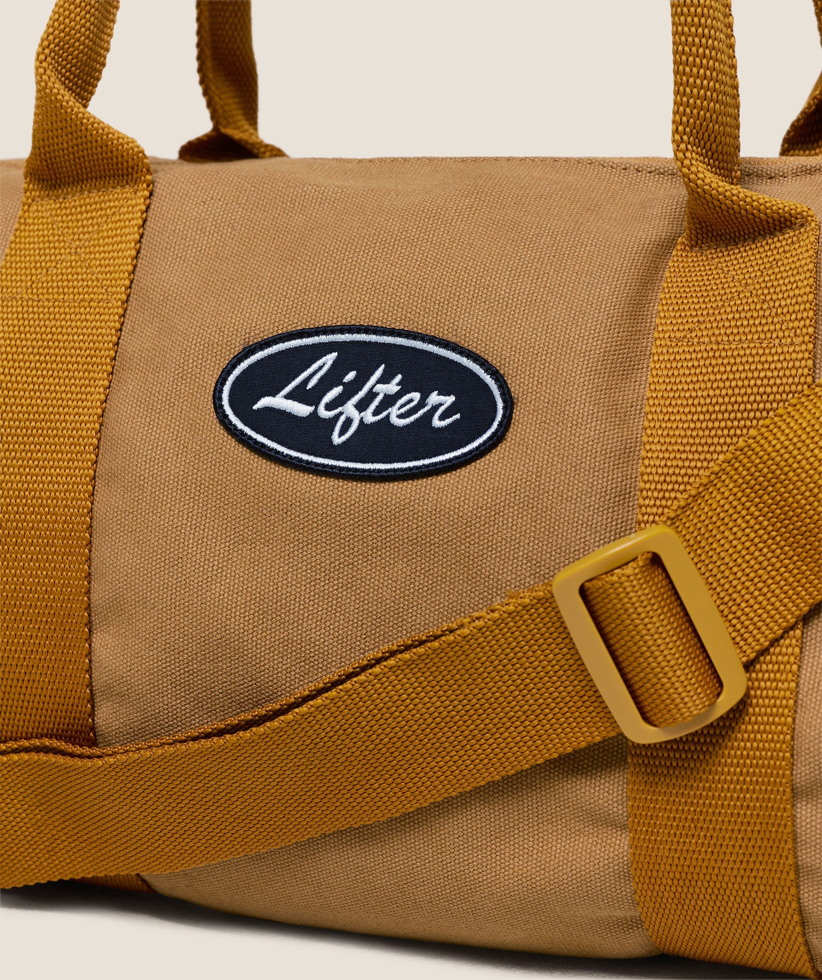 Gymshark Strength Dept Mini Canvas Duffle Bag Antique Gold