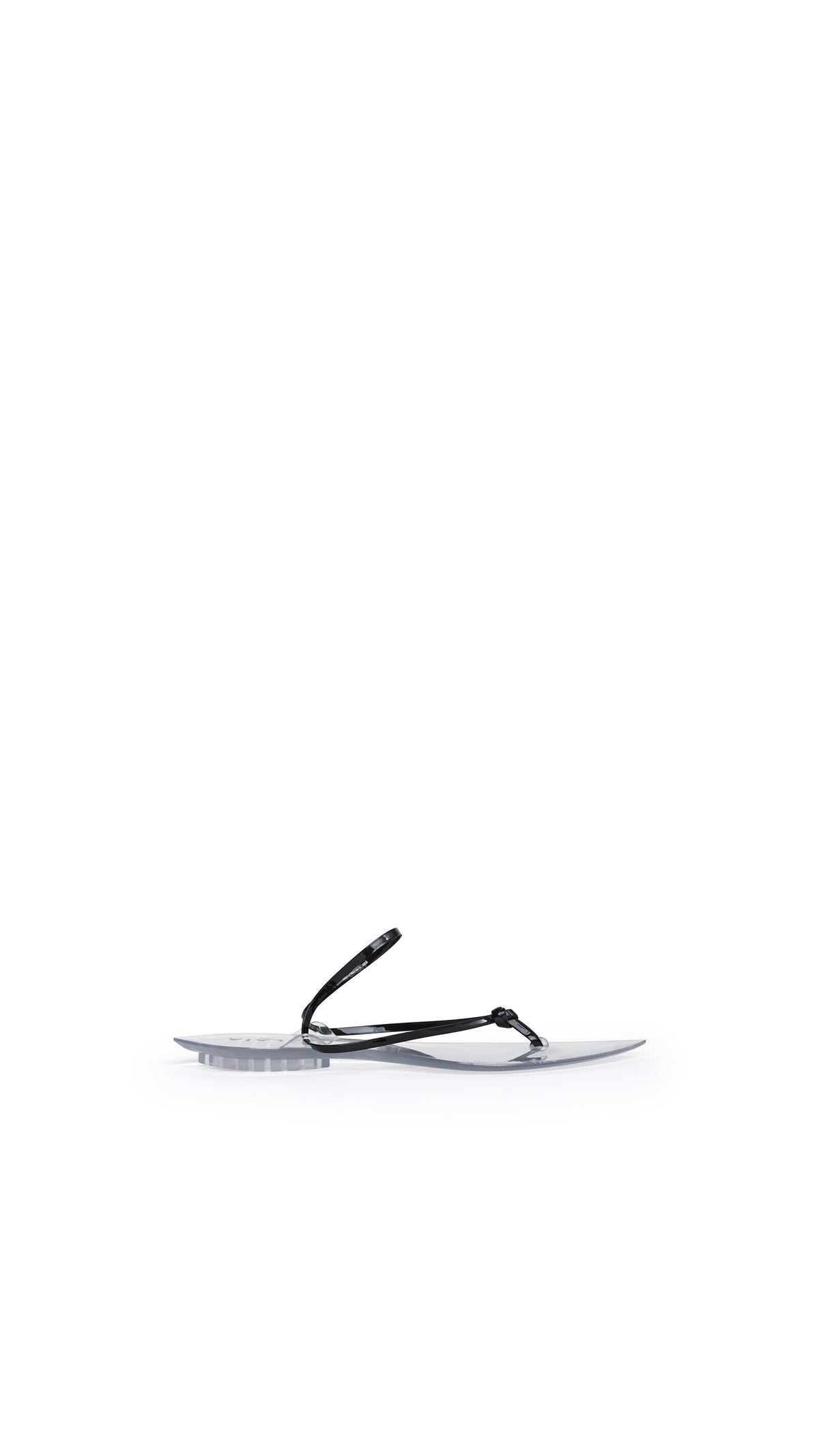 Alaïa Invisible Thong In Patent Leather