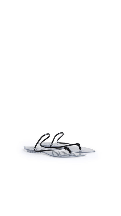 Alaïa Invisible Thong In Patent Leather