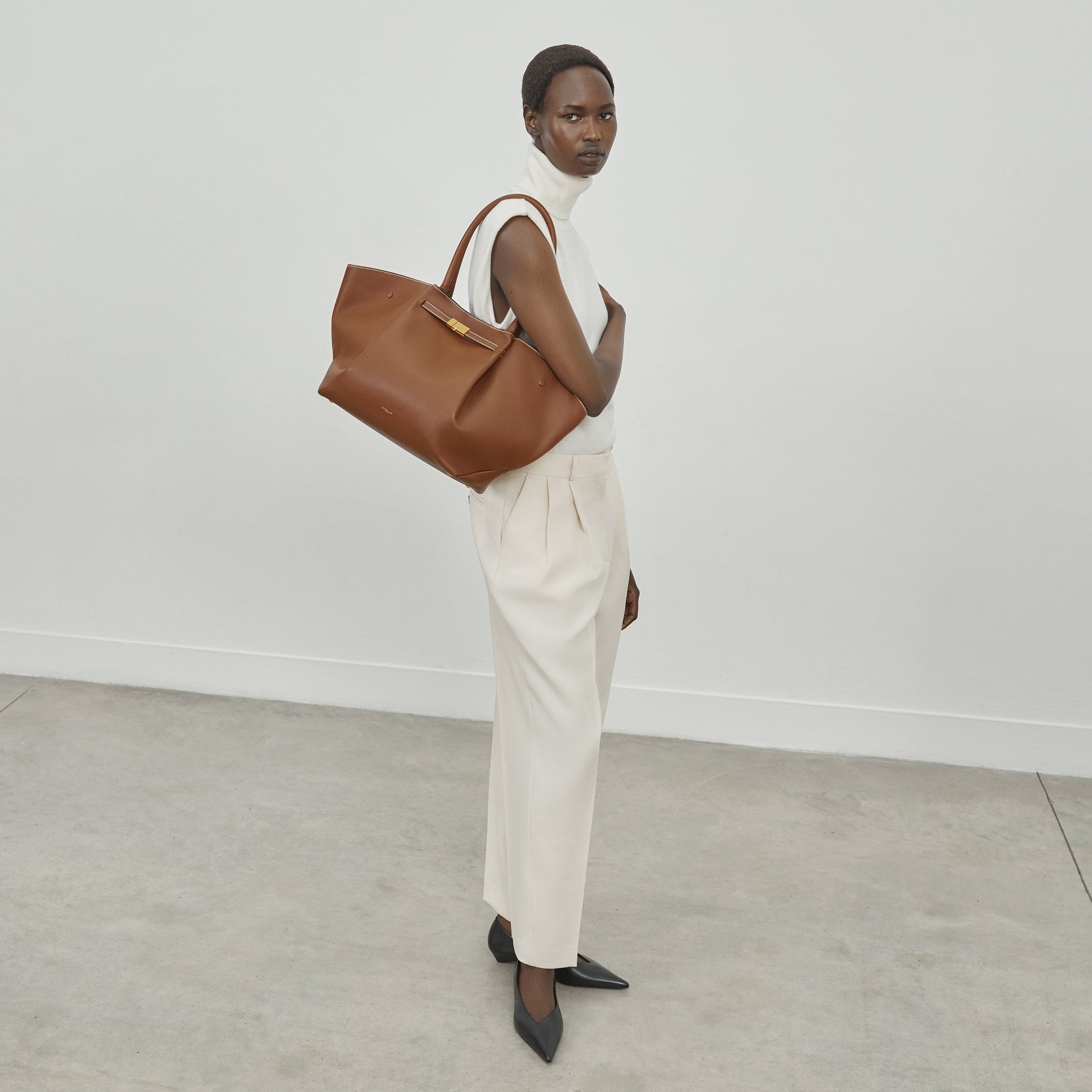 DeMellier The New York tan small grain ecru stitching