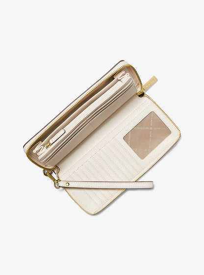 Jet Set Travel Large Pebbled Leather Wristlet Lt Cream Lt Cream